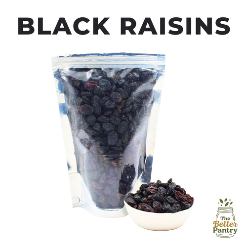 Bag of black raisins with a small bowl of raisins and 'The Better Pantry' logo.